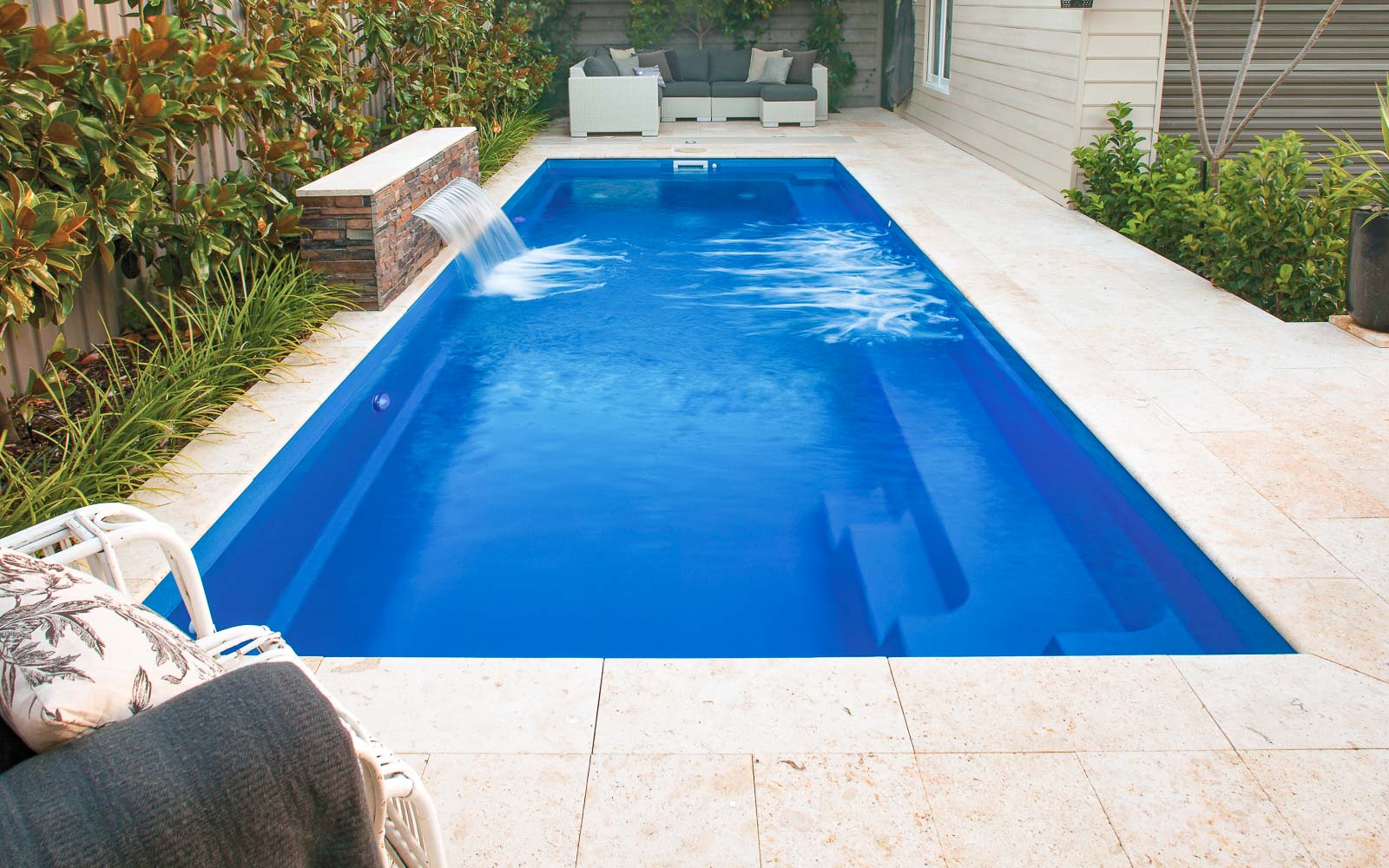 Leisure Pools Harmony fiberglass swimming pool with full bench