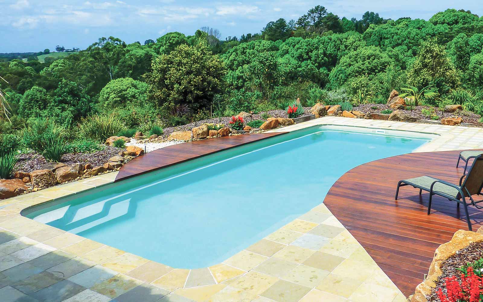 Leisure Pools Moroccan fiberglass swimming pool with built-in safety ledge