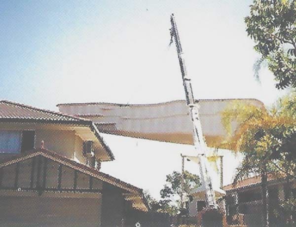 Crane Lifting A Leisure Pools Inground Fibreglass Swimming Pool