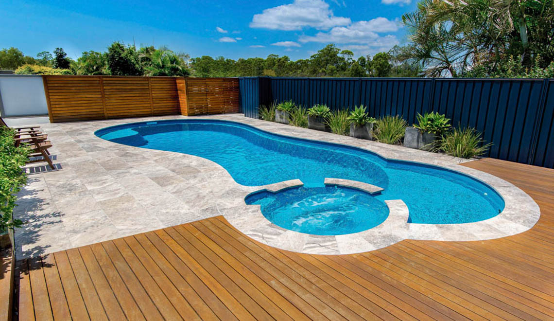 Leisure Pools Allure in-ground composite swimming pool with built-in spa and splash deck