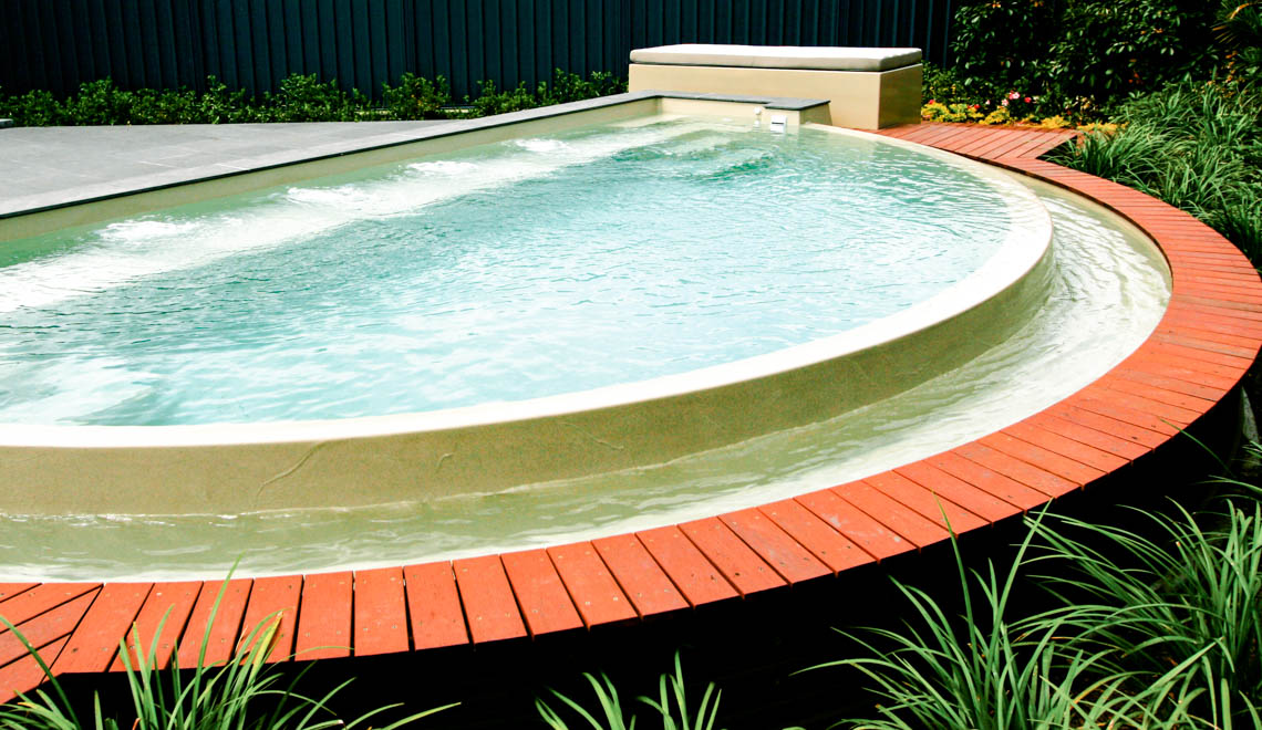 Leisure Pools Horizon composite swimming pool with an infinity edge