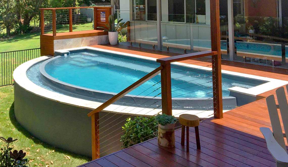 Leisure Pools Horizon composite fiberglass swimming pool with an infinity edge