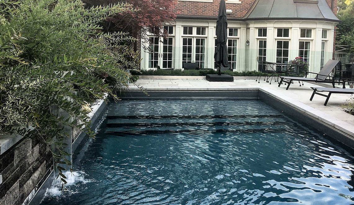 Leisure Pools Pinnacle swimming pool in Ebony Blue Leisure Pools Pinnacle large fiberglass swimming pool with built-in splash deck