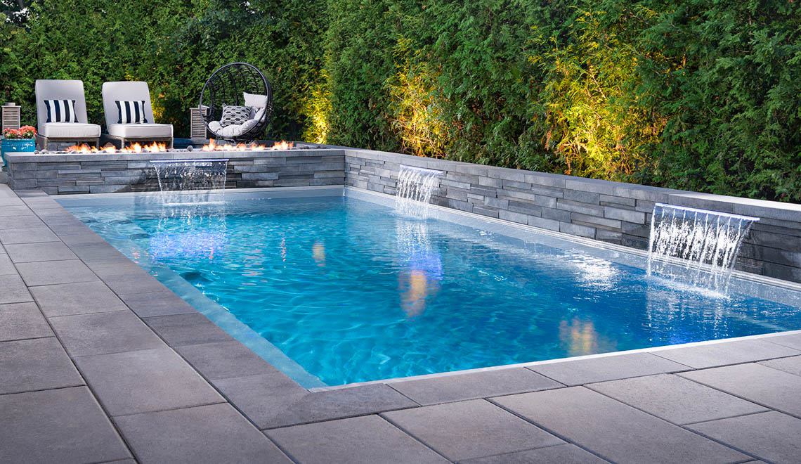 Leisure Pools Reflection swimming pool in Silver Grey Leisure Pools Reflection fiberglass swimming pool with full-length bench seat