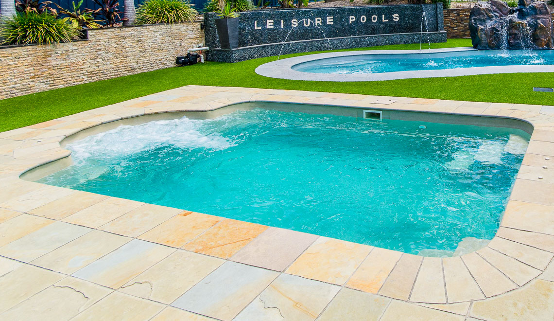 Leisure Pools Courtyard Roman in-ground fiberglass swimming pool