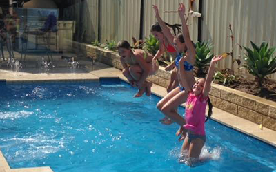 Kids jumping onto a Fibreglass Pool
