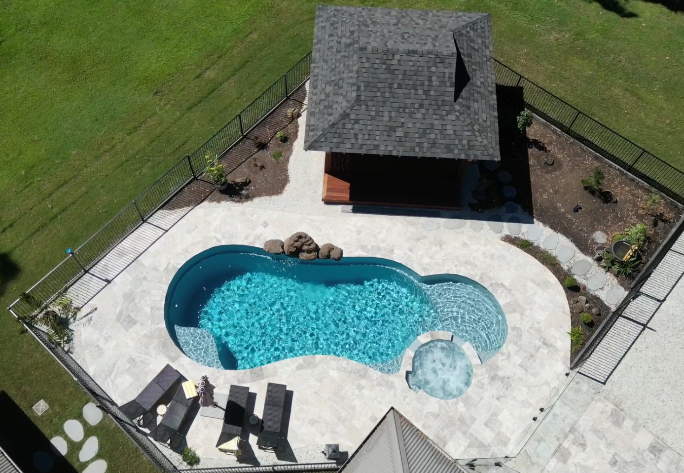 Silver Travertine Tiles around pool