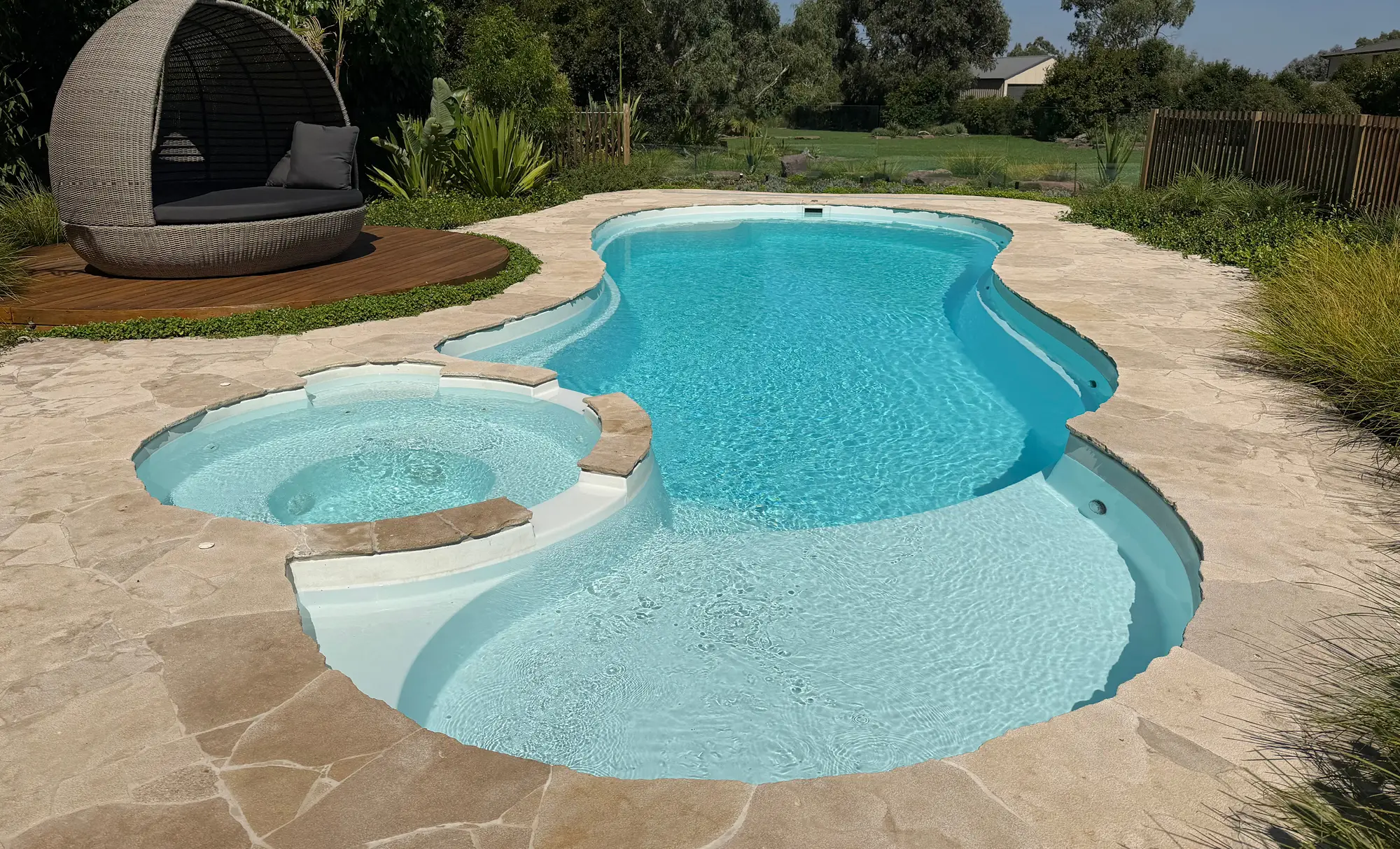Leisure Pools Allure fibreglass swimming pool with spa and tanning ledge