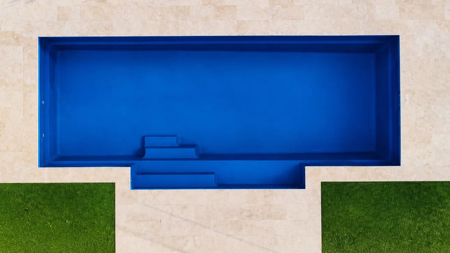 The Elegance 10.00m in Sapphire Blue, installed by Pinnacle Pools, in Woodhill, QLD The Elegance 10.00m in Sapphire Blue, installed by Pinnacle Pools, in Woodhill, QLD